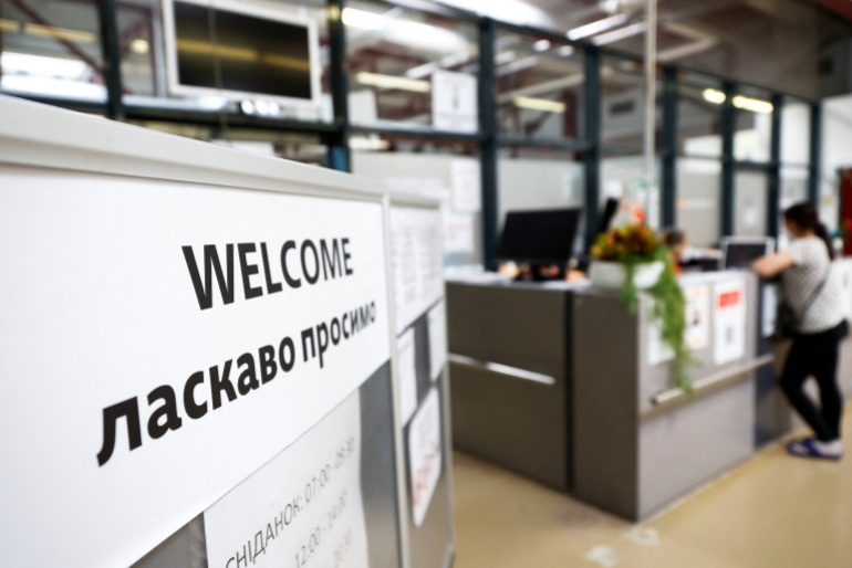 A view shows a welcome sign at the accommodation centre for refugees from Ukraine at the former Tegel airport in Berlin