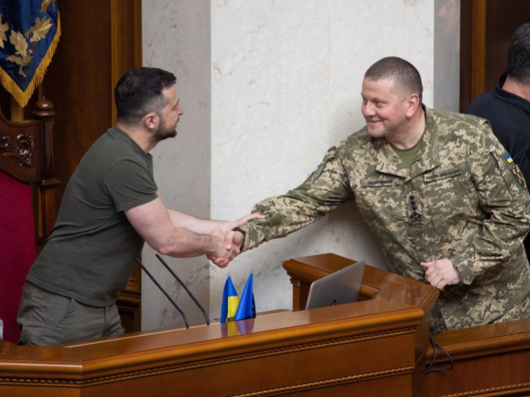 Ukraine's President Zelenskiy welcomes Commander-in-Chief of the Armed Forces of Ukraine Zaluzhnyi during a parliement session in Kyiv