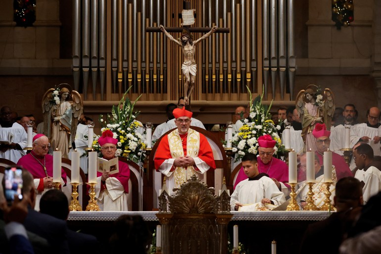 The Latin Patriarch of Jerusalem, Pierbattista Pizzaballa, leads a mass at the Church of Nativity in the Old City of Bethlehem, in the Israeli-occupied West Bank, December 24, 2024. REUTERS/Mohammed Torokman