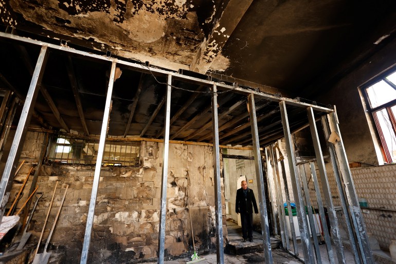 A Palestinian man stands in a mosque a day after Israeli army set fire at the Al-Nasser mosque in Nablus, amid West Bank raids, March 8, 2025. REUTERS/Raneen Sawafta