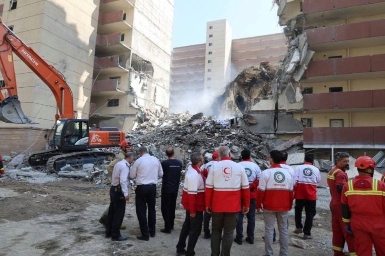 In this photo released by the Iranian Red Crescent Society rescuers work at the scene of an explosion after an Israeli strike in Tehran, Iran, Friday, June 13, 2025. (Iranian Red Crescent Society via AP)