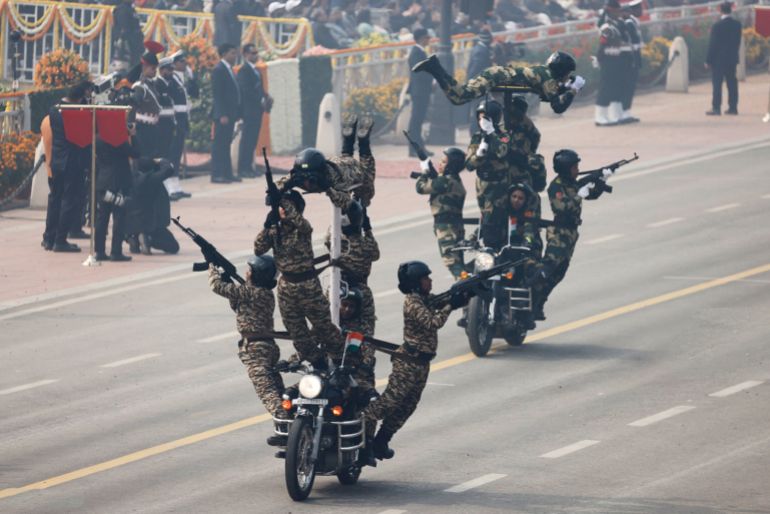 India soldiers on motorbikes demonstrate their skills during India's 75th Republic Day parade in New Delhi on January 26, 2024. President Emmanuel Macron was guest of honour for India's pomp-filled annual military parade, in a state visit aimed at shoring up France's strategic ties with the world's fifth-largest economy. (Photo by Ludovic MARIN / AFP) (Photo by LUDOVIC MARIN/AFP via Getty Images)