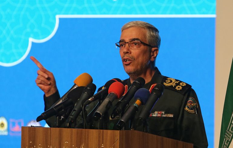 (FILES) Iranian Armed Forces Chief of Staff Major General Mohammad Bagheri speaks during the the International Conference on the Legal-International Claims of the Holy Defense in the capital Tehran on February 23, 2021.