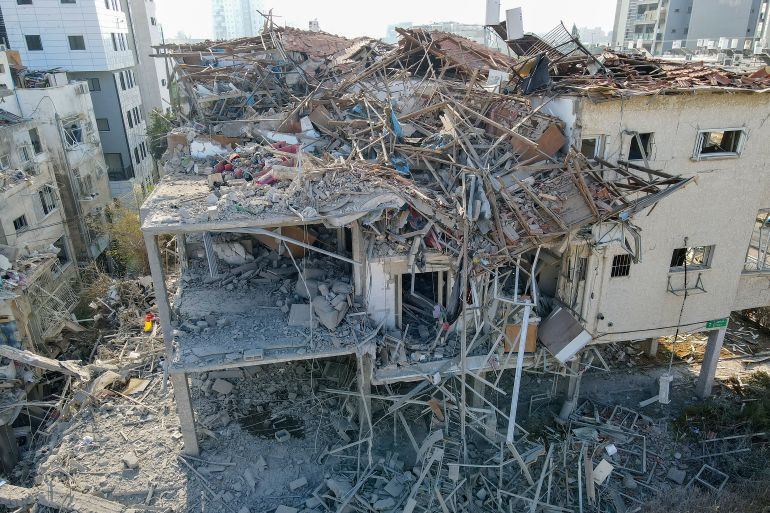 This aerial picture shows damaged buildings at a site hit by a missile fired from Iran in the Israeli city of Ramat Gan near Tel Aviv on June 14, 2025.