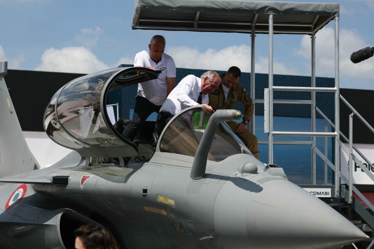 France's Prime Minister Francois Bayrou exits the cockpit of Rafale standard F4 fighter jet during the 55th edition of the International Paris Air Show at the Paris–Le Bourget Airport, in Le Bourget, suburb of Paris on June 16, 2025. (Photo by Alain JOCARD / AFP)