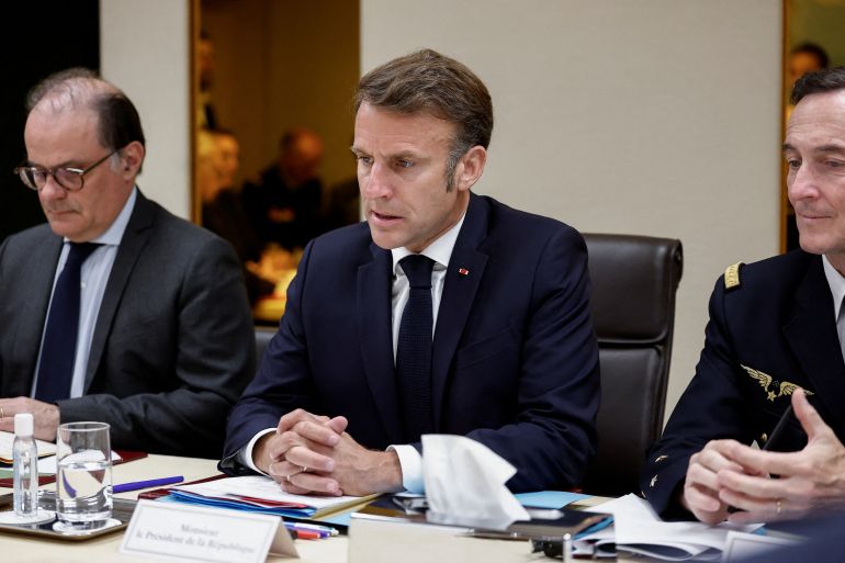 French President Emmanuel Macron (C}, flanked by Presidency General Secretary Emmanuel Moulin (L) and Chief of Military Staff of the President of the Republic (CEMP) Fabien Mandon, holds a Defence and National Security Council meeting following US air strikes on nuclear facilities in Iran, at the Elysee Palace in Paris on June 22, 2025.