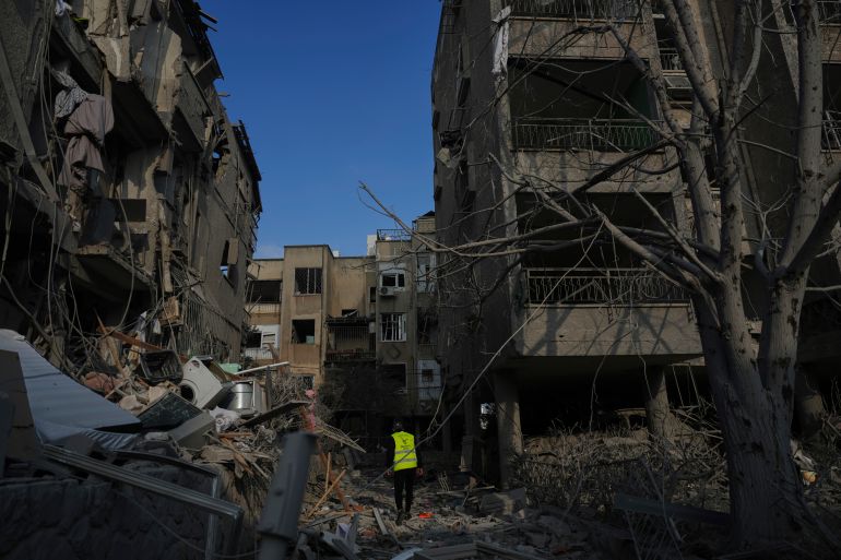 Israeli security forces inspect destroyed residential buildings that were hit by a missile fired from Iran, in Ramat Gan, near Tel Aviv, Israel on Saturday, June 14, 2025. (AP Photo/Ariel Schalit)