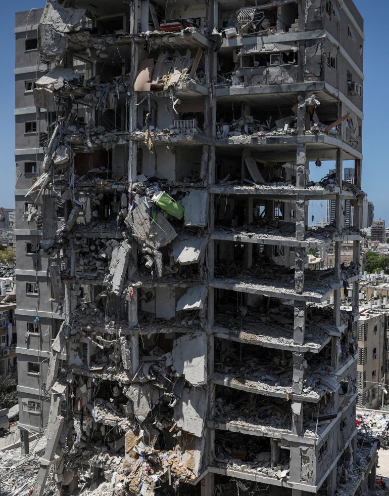 A building stands damaged following a missile attack from Iran, in Bat Yam, Israel, June 15, 2025. REUTERS/Ronen Zvulun