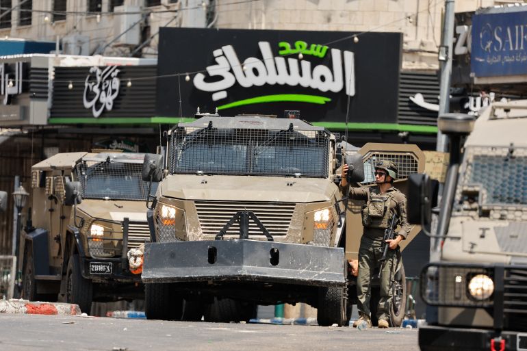 An Israeli soldier takes part in an Israeli raid an Israeli raid in Nablus, the Israeli-occupied West Bank, June 10, 2025. REUTERS/Raneen Sawafta