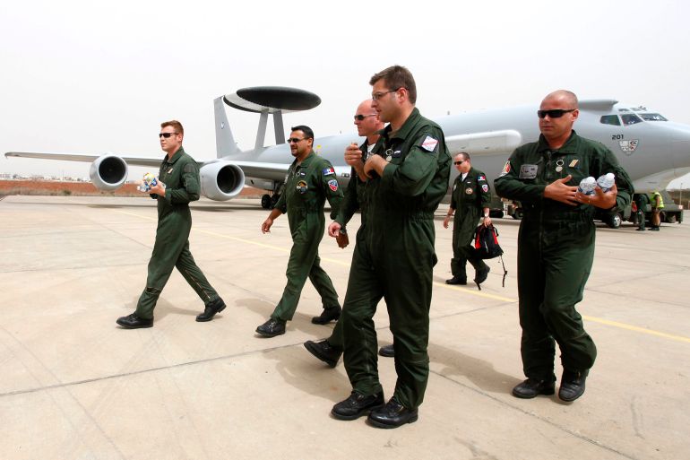 French military personnel walk from a AWACS (Airborne Warning and Control Systems) aircraft at the Dakar French air base, June 3, 2009, after returning from search mission to locate an Air France plane that went missing on Sunday night. French officials said on Wednesday they may never discover why an Air France aircraft crashed into the Atlantic killing 228 people and cautioned they might not even find the plane's black boxes on the ocean floor. REUTERS/Normand Blouin (SENEGAL TRANSPORT MILITARY DISASTER)