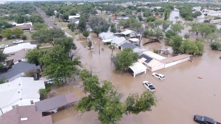 A drone view shows flooded houses, following torrential rains that unleashed flash floods along the Guadalupe River in San Angelo, Texas, U.S., June 4, 2025, in this screen grab obtained from a social media video. Patrick Keely via REUTERS THIS IMAGE HAS BEEN SUPPLIED BY A THIRD PARTY. MANDATORY CREDIT. NO RESALES. NO ARCHIVES. TPX IMAGES OF THE DAY