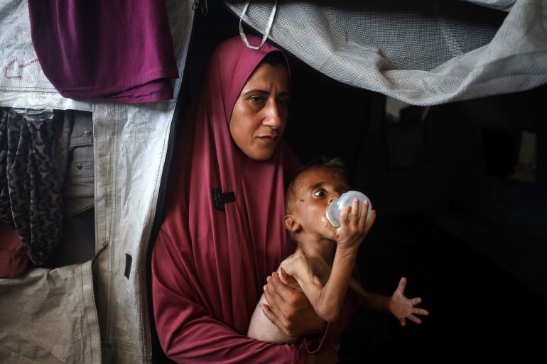 Hidaya, a 31-year-old Palestinian mother, sits with her sick 18-month-old son Mohammed al-Mutawaq, who also displays signs of malnutrition, inside their tent at the Al-Shati refugee camp in Gaza City, Palestine, on July 25, 2025. (Photo by Majdi Fathi/NurPhoto via Getty Images)Hidaya, a 31-year-old Palestinian mother, sits with her sick 18-month-old son Mohammed al-Mutawaq, who also displays signs of malnutrition, inside their tent at the Al-Shati refugee camp in Gaza City, Palestine, on July 25, 2025. (Photo by Majdi Fathi/NurPhoto via Getty Images)