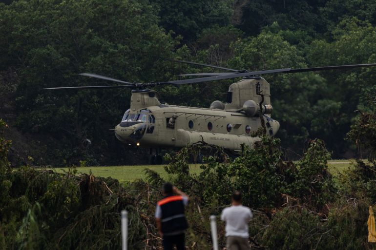 HUNT, TEXAS - JULY 6: A Chinook helicopter takes off near Camp Mystic after picking up troops that aided in search and recovery efforts on July 6, 2025 in Hunt, Texas. Heavy rainfall caused flooding along the Guadalupe River in central Texas with multiple fatalities reported. Jim Vondruska/Getty Images/AFP (Photo by Jim Vondruska / GETTY IMAGES NORTH AMERICA / Getty Images via AFP)