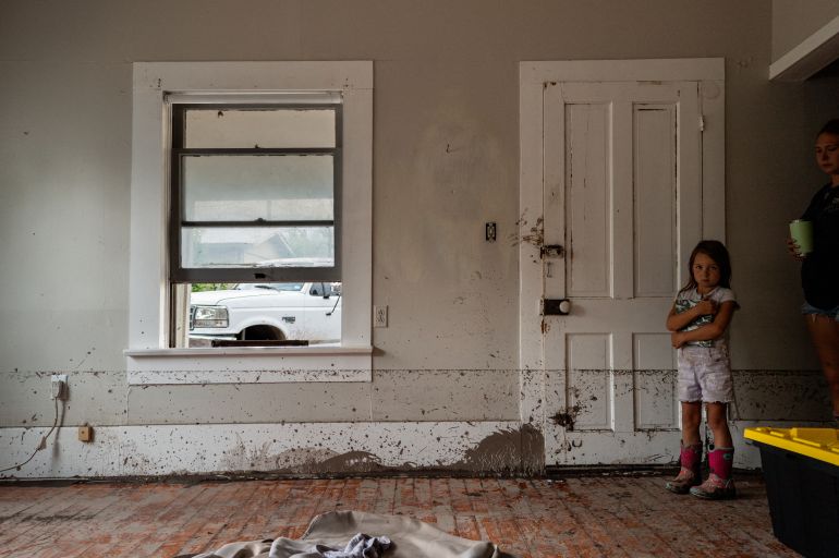 CENTER POINT, TEXAS - JULY 06: Ayzlin Garcia stands in her aunt Audrey's home after it was flooded on July 06, 2025 in Center Point, Texas. "We've lost pretty much everything in our house, but we're blessed because we still have our lives, there are people who didn't make it," said her uncle Nathan. Heavy rainfall caused severe flooding along the Guadalupe River in central Texas, leaving more than 70 people reported dead. Brandon Bell/Getty Images/AFP (Photo by Brandon Bell / GETTY IMAGES NORTH AMERICA / Getty Images via AFP)