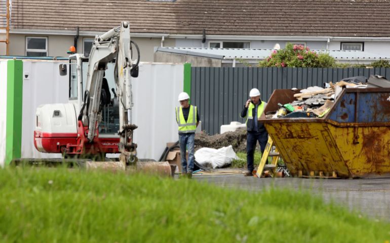 Workman prepare at the excavation site of the Mother and Baby institution in Tuam, at the site in Co Galway, western Ireland, on July 7, 2025, ahead of excavations commencing.