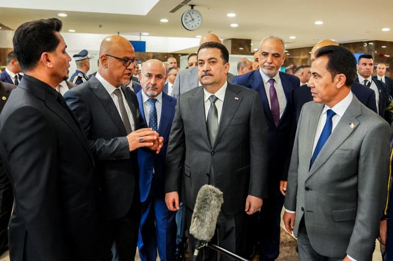 This handout picture released by Iraq's Prime Minister's Media Office shows Prime Minister Mohammed Shia al-Sudani meeting with officials during the re-opening of Mosul International Airport in northern Iraq on July 16, 2025.