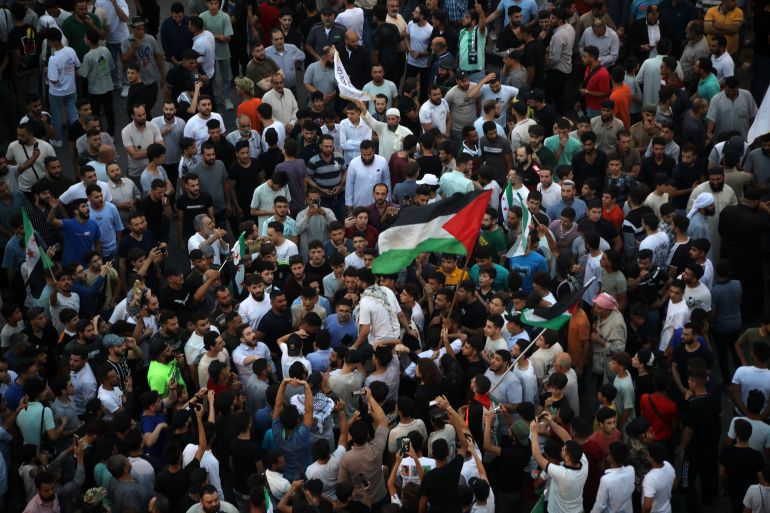 People take to the streets of Hama to protest against Israeli intervention in Syria, on July 16, 2025.