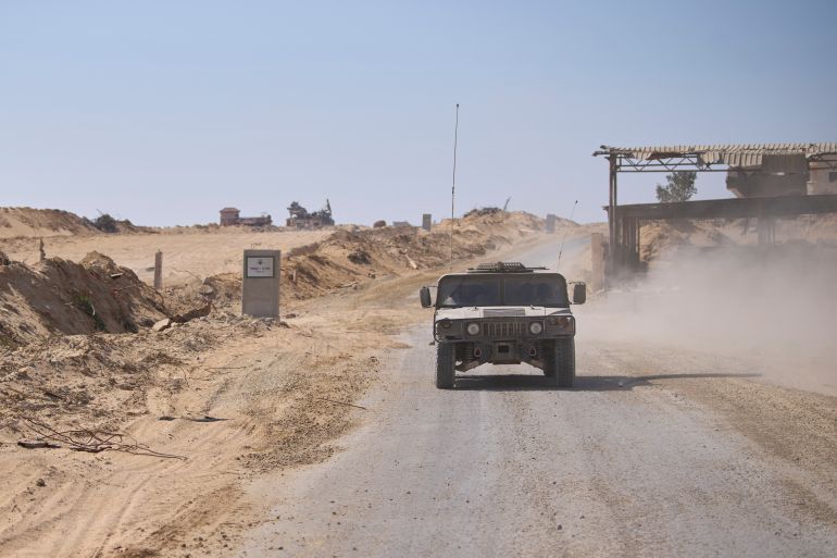 Israeli army vehicles transport a group of soldiers and journalists along the Morag corridor in southern Gaza on June 8, 2025. The Israeli military invited reporters for a tour in the European Hospital in Khan Younis. (AP Photo/Ohad Zwigenberg)