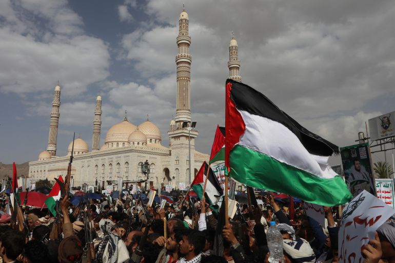 Houthi supporters wave Palestinian flags during a weekly protest against the U.S. and Israel in Sanaa, Yemen, Friday, July 11, 2025. (AP Photo/Osamah Abdulrahman)