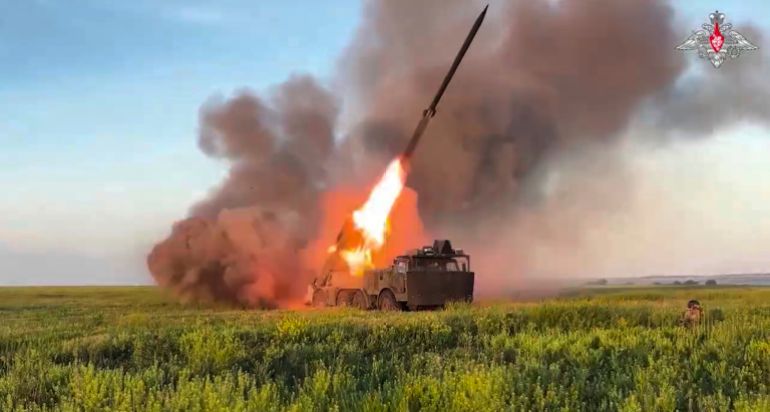In this photo taken from video distributed by Russian Defense Ministry Press Service on Thursday, July 17, 2025, a Russian self-propelled multiple rocket launcher fires towards a Ukrainian position in Ukraine. (Russian Defense Ministry Press Service via AP)