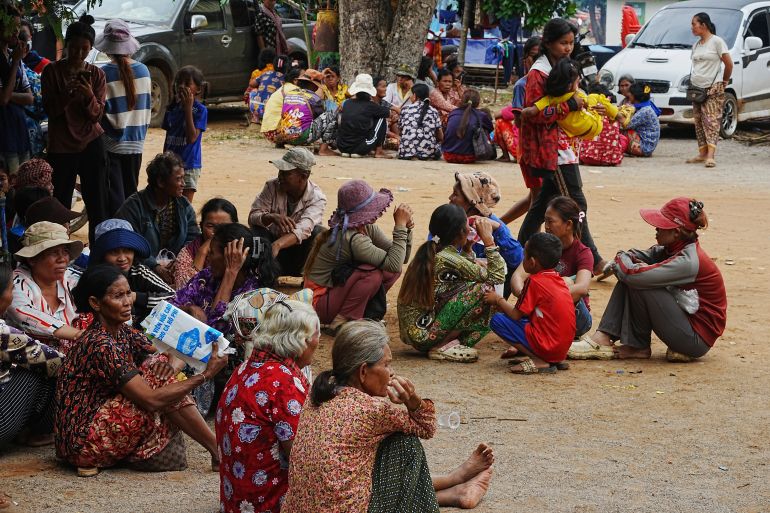 Local villagers wait to receive food donated from a charity as they take refuge in Wat Phnom Kamboar, Oddar Meanchey province, Cambodia, Sunday, July 27, 2025, amid the fighting between Thailand and Cambodia. (AP Photo/Heng Sinith)