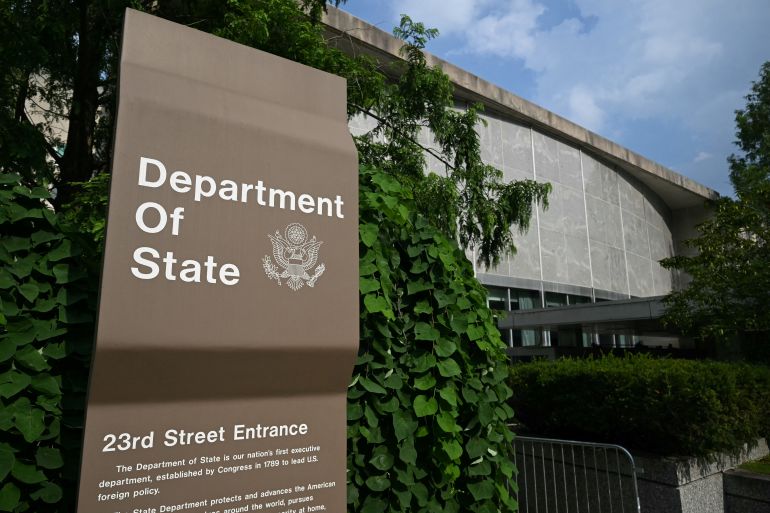 A sign is seen outside the US State Department in Washington, DC, on July 11, 2025. The US State Department began laying off more than 1,300 employees as part of President Donald Trump's campaign to massively downsize the federal government workforce. A State Department official said 1,107 members of the civil service and 246 Foreign Service employees were being informed that they were being fired. (Photo by SAUL LOEB / AFP)