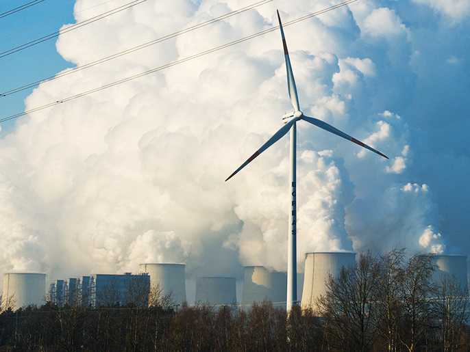 epa03695620 (FILE) A single wind turbine turns in front of the cooling towers of the brown coal power plant operated by Vattenfall AG in Jaenschwalde, Germany, 22 November 2011. US government scientists who monitor carbon dioxide in the atmosphere from Hawaii said on 10 May 2013 that the concentration of CO2 in the atmosphere is the highest it has been in millions of years. The amount of carbon dioxide in the atmosphere has steadily risen from 317 parts per million in 1958, when measurements began, to 400, according to the CO2 monitoring programme at the Scripps Institution of Oceanography. Scientists believe the last time CO2 levels were at the 400 parts per million level was two to four million years ago. EPA/PATRICK PLEUL