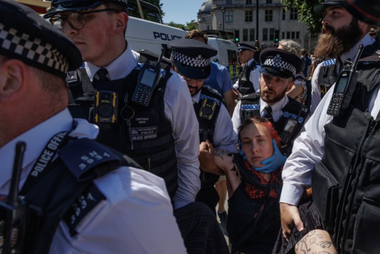 LONDON, UNITED KINGDOM - JULY 12: A protester is arrested as people take part in a protest against Palestine Action's proscription as a terrorist organisation at Parliament Square on July 12, 2025 in London, England. This protest is the second held by pro-Palestinian groups since the UK Parliament's decision to proscribe Palestine Action as a terror group. Yesterday, the UN Human Rights Office announced that 798 people have been killed while trying to access aid in Gaza since the end of May. (Photo by Dan Kitwood/Getty Images)