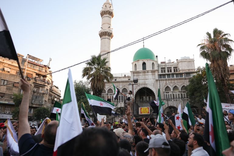 DAMASCUS, SYRIA - JULY 16: Demonstrators gather during a rally against Israeli intervention in Syria on July 16, 2025 in Damascus, Syria. A rally was held in Damascus in support of Syria's interim government and to denounce Israel's intervention following recent clashes between Syrian government forces and Druze militia in the southern Syrian city of Sweida, or Suwayda. A spokesperson from the Israeli Defense Forces (IDF) confirmed Wednesday that Israeli airstrikes targeted the headquarters of Syria's defence ministry and a site near the presidential palace in Damascus. (Photo by Ali Haj Suleiman/Getty Images)
