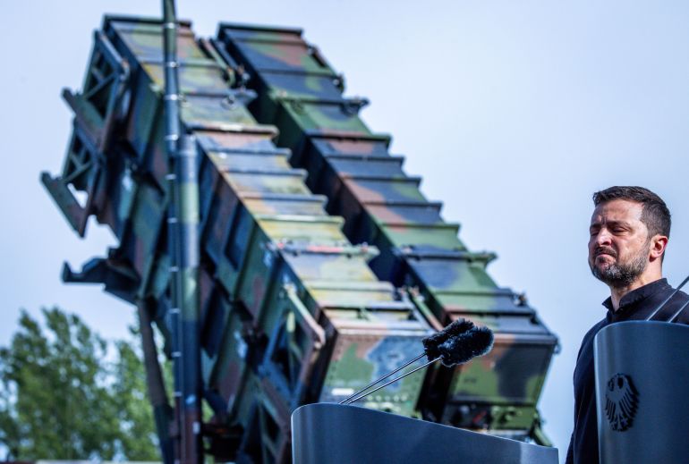 MECKLENBURG, GERMANY - JUNE 11: Volodymyr Zelensky, President of Ukraine, stands in front of a Patriot anti-aircraft missile system during his visit to a military training area on June 11, 2024 in Mecklenburg, Germany. Zelensky is in Berlin to also attend the Ukrainian Recovery Conference. Germany is the second biggest donor of military aid to Ukraine. (Photo by Jens Büttner - Pool/Getty Images)