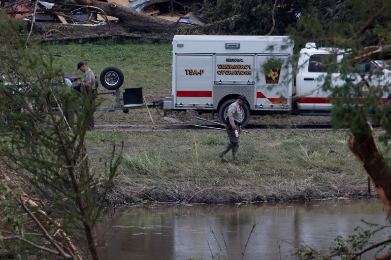 Members from Texas Game Wardens of the Law Enforcement Divison work following flash flooding, in Kerrville, Texas, U.S. July 6, 2025. REUTERS/Marco Bello