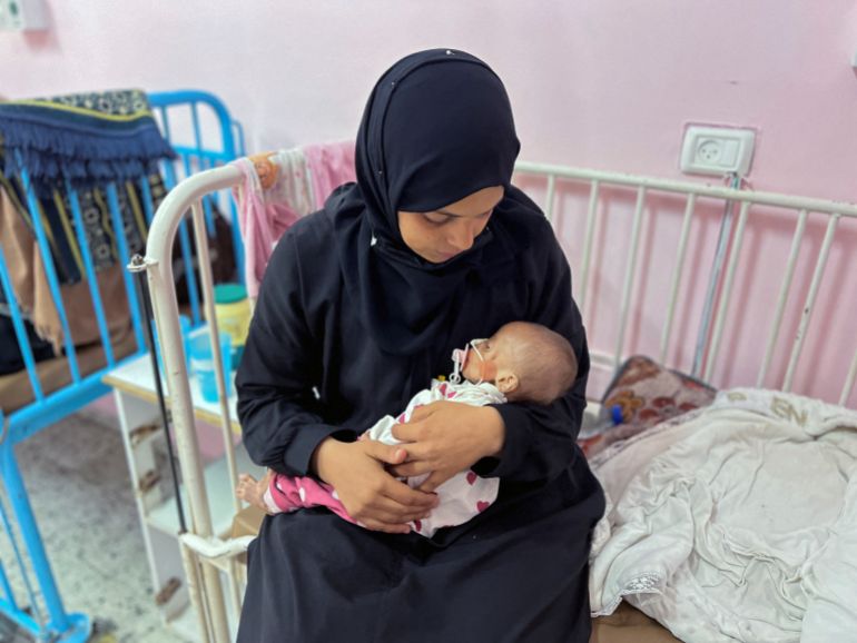 Palestinian mother Israa Abu Haleeb looks after her five-month-old daughter, Zainab, who is diagnosed with malnutrition, according to medics, at Nasser hospital in Khan Younis, in the southern Gaza Strip July 15, 2025. REUTERS/Hussam Al-Masri TPX IMAGES OF THE DAY