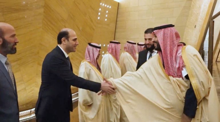 Saudi Crown Prince Mohammed bin Salman shakes hands with Hazem al-Sharaa, the brother of Syrian President Ahmed al-Sharaa, in Riyadh, Saudi Arabia, February 2, 2025 in this screengrab taken from a handout video. Saudi Royal Court/Handout via REUTERS TV THIS IMAGE HAS BEEN SUPPLIED BY A THIRD PARTY