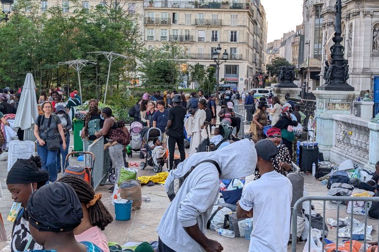 PARIS, FRANCE - AUGUST 12: French police evacuates a 250-person migrant camp set up by Utopia 56 association to request accommodation outside the Paris City Hall in Paris, France on August 12, 2025. Police cited the heatwave and health risks as reasons for the evacuation. The migrants were transferred by bus to accommodation centers in the regions, including Marseille, Bourges and Besancon. (Photo by Luc Auffret/Anadolu via Getty Images)
