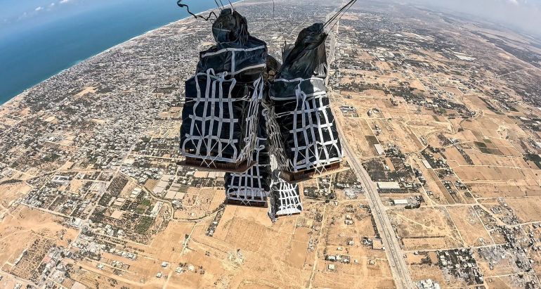 Humanitarian aid is dropped over the Gaza Strip from a Belgian aircraft, obtained by Reuters August 3, 2025. Belgian Defence Ministry/Handout via REUTERS THIS IMAGE HAS BEEN SUPPLIED BY A THIRD PARTY TPX IMAGES OF THE DAY