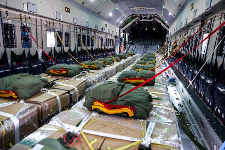 Humanitarian aid pallets with parachutes attached are pictured in the cargo bay of a German Air Force (Luftwaffe) A400M Atlas military transport aircraft before their release during an airdrop relief mission over the Gaza Strip on August 5, 2025.