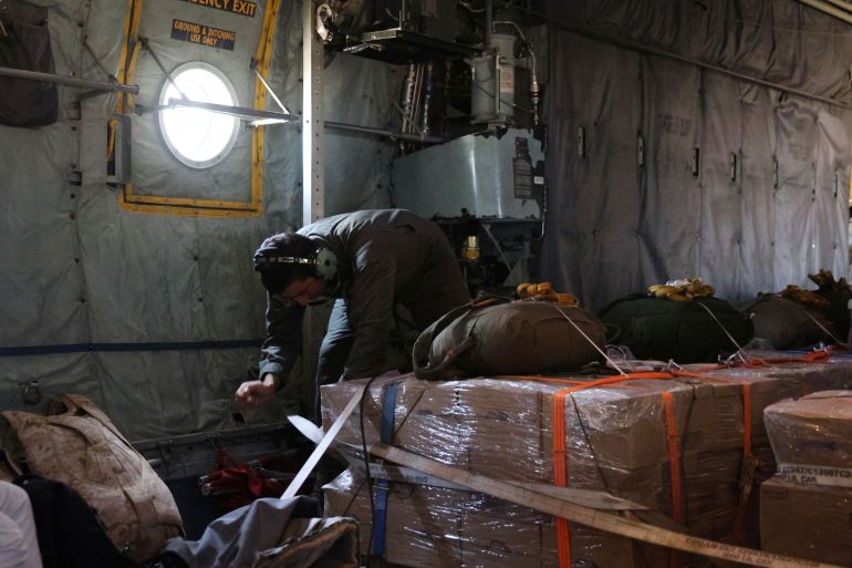 GAZA - AUGUST 6: Jordanian air force personnel in a Jordanian C-130 military aircraft prepare to perform an air drop of aid and humanitarian supplies on August 6, 2025 in Gaza. On Wednesday, the Royal Jordanian Air Force carried out air drops of food and other aid over Gaza, alongside aircraft from other nations carrying 54 tons of humanitarian supplies. Airdrops of aid have resumed in recent weeks in an attempt to alleviate the severe lack of food and other essentials reaching people in Gaza, where the World Food Programme (WFP) has said over half a million people are enduring famine-like conditions, as Israel continues to restrict the flow of aid. (Photo by Salah Malkawi/Getty Images)