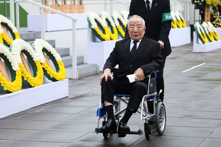Hiroshi Nishioka, 93, a survivor of the 1945 Nagasaki atomic bombing, looks on after delivering a speech on the day of a ceremony commemorating the 80th anniversary of the bombing of the city, at Nagasaki's Peace Park in Nagasaki, southwestern Japan, August 9, 2025. REUTERS/Issei Kato