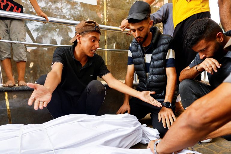 Mourners react during the funeral of Palestinians killed in Israeli fire while seeking aid on Saturday, according to medics, in Gaza City, August 10, 2025. REUTERS/Mahmoud Issa TPX IMAGES OF THE DAY