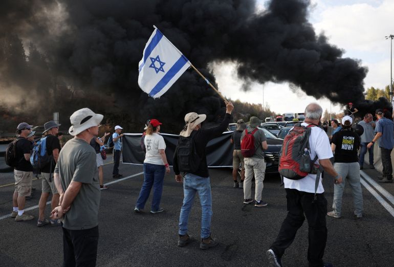 Demonstrators block Israel's main highway connecting Jerusalem and Tel Aviv, after families of hostages have called for a nationwide strike to demand the return of all hostages and an end to the war in Gaza, in Latrun Israel August 17,2025 REUTERS/Ronen Zvulun