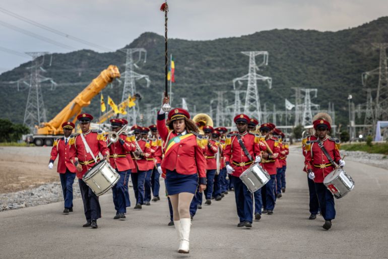 Members of the Ethiopian Republic March Band perform at the Grand Ethiopian Renaissance Dam (GERD) ahead of its official inauguration ceremony in Guba, on September 9, 2025. (Photo by Luis TATO / AFP)