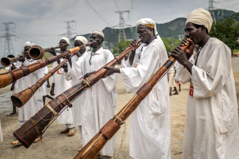 Performers play traditional instruments during the official inauguration ceremony of the Grand Ethiopian Renaissance Dam (GERD) in Guba, on September 9, 2025.