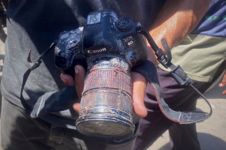 FILE - In this family handout photo a person shows the blood-stained camera that freelance journalist Mariam Dagga, 33, was carrying when she was killed in an Israeli strike on Nasser Hospital in Khan Younis, southern Gaza Strip, Monday, Aug. 25, 2025. (Family Handout via AP, File)