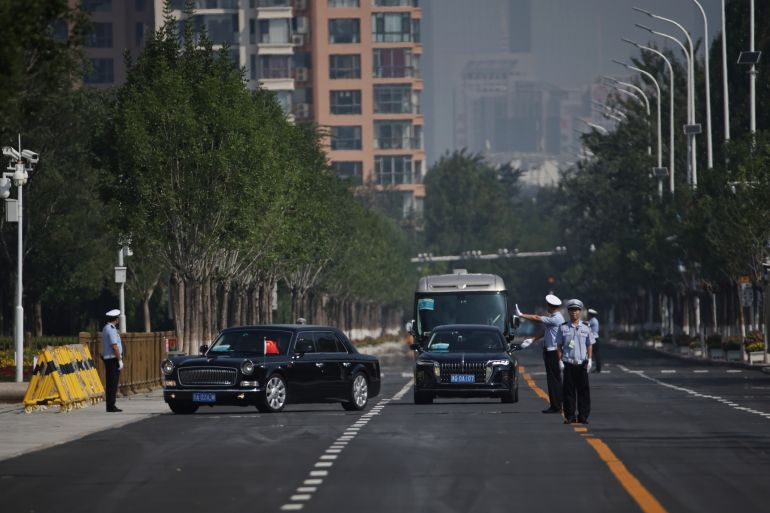 epa12341808 A car carrying the flag of the president of Belarus (L) and China’s flag arrives to the Tianjin Meijian Convention and Exhibition Center, before the start of the session of the Shanghai Cooperation Organization (SCO) Summit 2025 in Tianjin, China, 01 September 2025. The Shanghai Cooperation Organization (SCO) Summit 2025 is held in Tianjin on 31 August and 01 September. EPA/ANDRES MARTINEZ CASARES