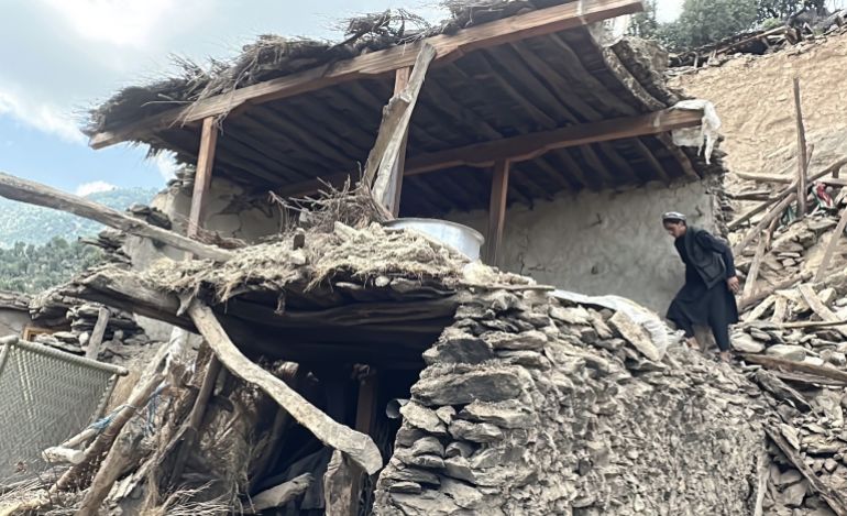 epa12353978 Afghan local Hamidullah surveys his damaged house in Kunar, Afghanistan, 04 September 2025 (issued 05 September 2025). Hamidullah lost all of his family members, including parents and siblings, in the earthquake while he was in Jalalabad. At least 2,200 people were killed after a shallow magnitude-6.0 earthquake and several aftershocks hit Nangarhar and Kunar in eastern Afghanistan on 31 August 2025. EPA/HAMID SABAWOON