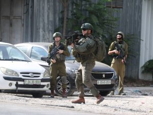 قنابل غاز وهدم محال تجارية واقتحامات واسعة بالضفة