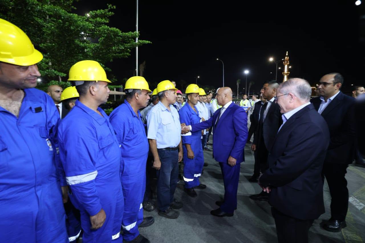 May be an image of one or more people and oil refinery